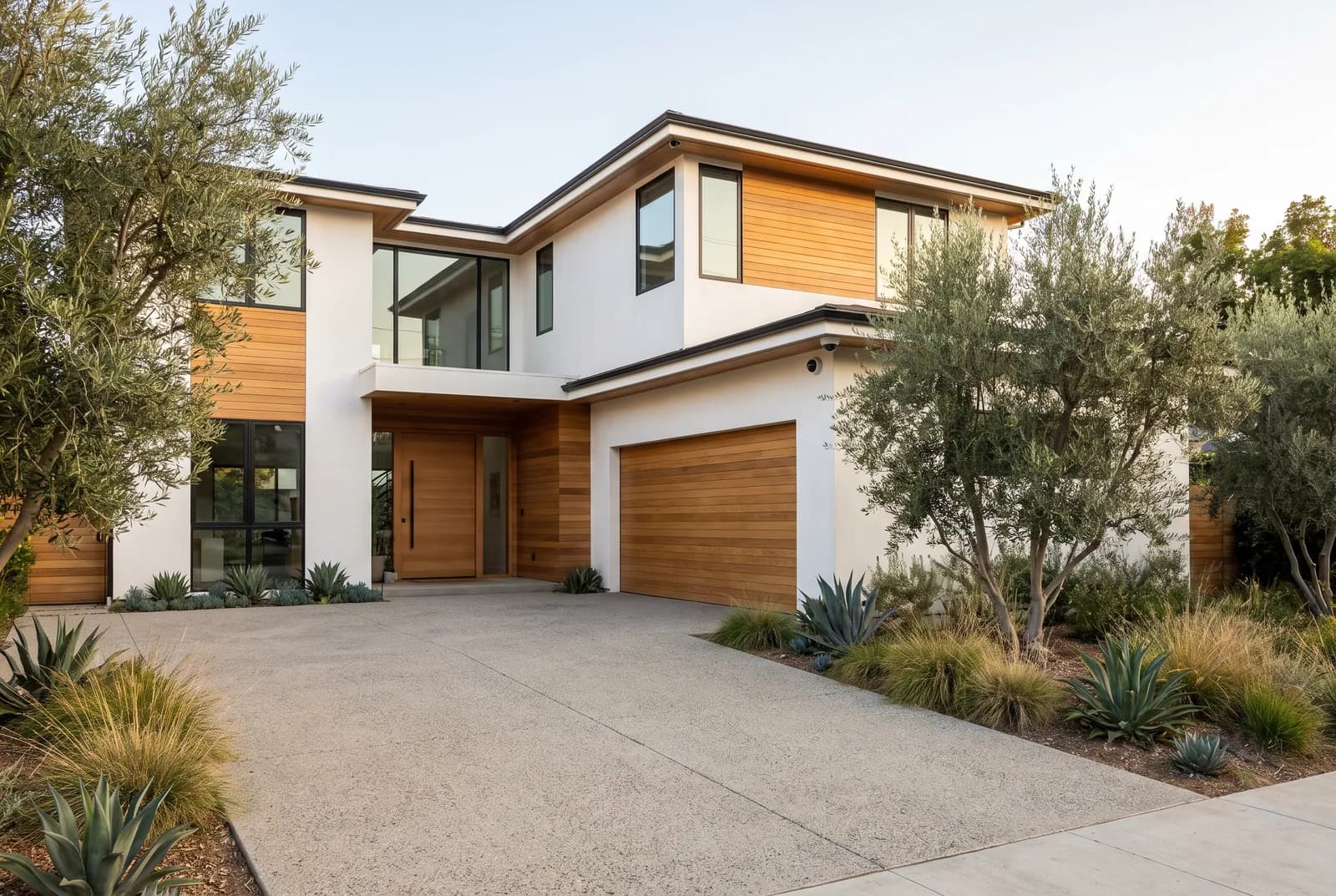 Modern Southern California home with a discreet security camera mounted at the corner of the building